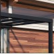 Stockholm 3.5x6.6m aluminium wall-mounted pergola Anthracite grey and Canopia transparent roof